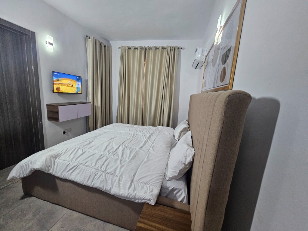 Master suite side view featuring smart TV and executive console